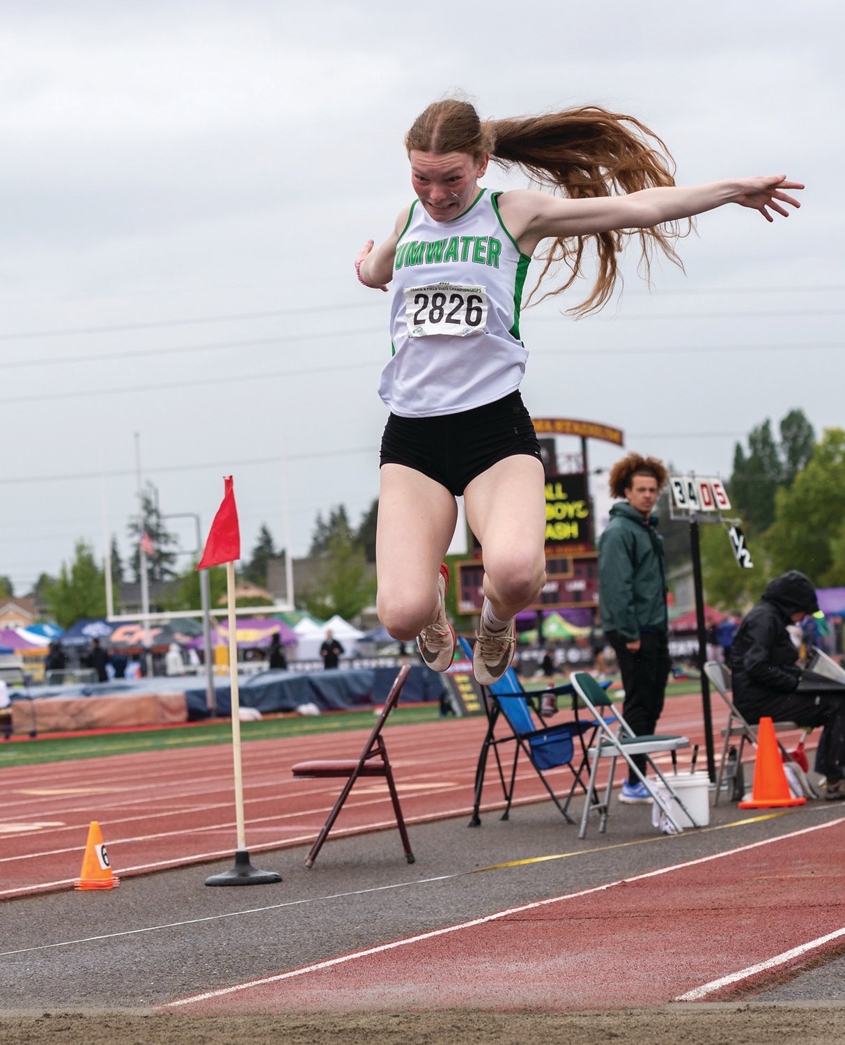 Tumwater's Alyssa Duncan flies through the air in the 2A Girls Triple Jump at the 4A/3A/2A State Track and Field Championships on Saturday, May 28, 2022, at Mount Tahoma High School in Tacoma. (Joshua Hart/For The Chronicle)